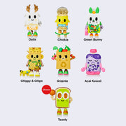 Lineup of 7 differently designed vinyl figures, all of cartoon health foods. Options include Oatis, Chickie, Green Bunny, Chippy & Chips, Greenie, Acai Kawaii and Toasty.