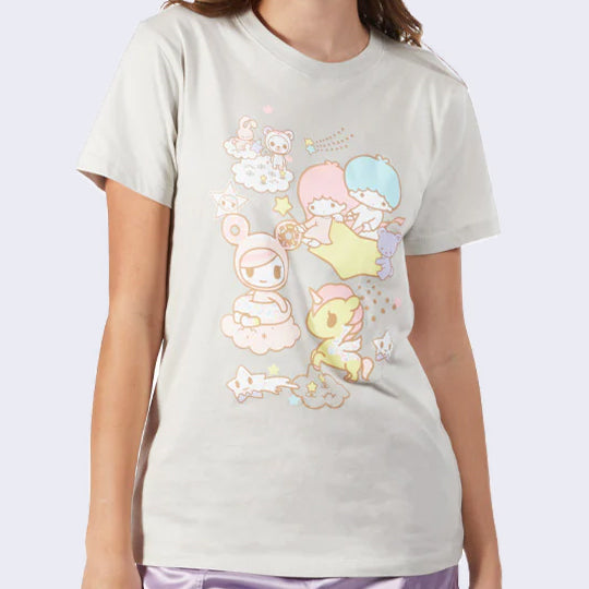 Light beige-ish gray fitted t-shirt, with a graphic in the center of the shirt featuring Little Twin Star riding atop of a star, next to Donutella, a Unicorno and other tokidoki characters.