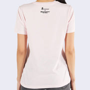 The back view of person wearing light pink t-shirt with Sanrio's Little Twin Stars riding similarly decorated Unicornos.