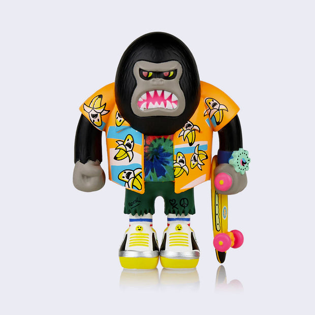 Vinyl "Banana Thrasher" figure. A stylized gorilla character wearing a Hawaiian-style shirt with bananas on it. Character is holding a skateboard.