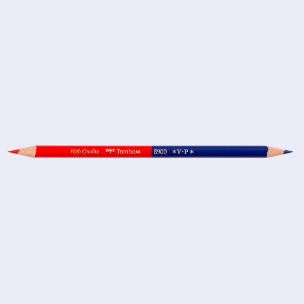 A sharpened dual tip colored pencil, with one end red and the other blue.