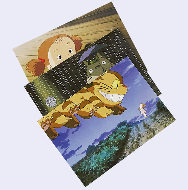 Example of postcards featuring artwork from My Neighbor Totoro, including graphics of a large Catbus descending on a field.