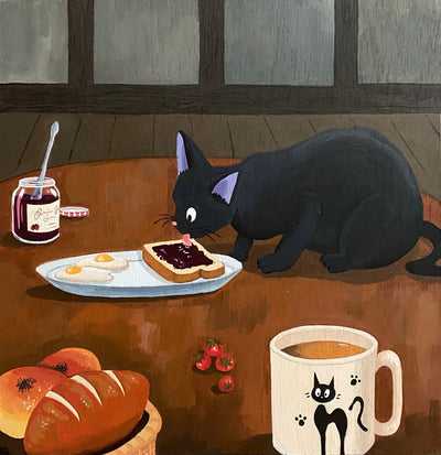 Illustration of Jiji, from Kiki's Delivery Service, up on a wooden table and licking a slice of jellied toast on a plate with eggs. On the table is a jam jar, coffee mug, tomatoes and bread basket.