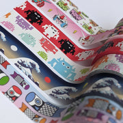 Close up group photo of 6 differently designed washi tapes. Designs include boba pattern, kawaii gundam, red, white and black Big Boss, pastel Big Boss, wave pattern, and koinobori pattern.