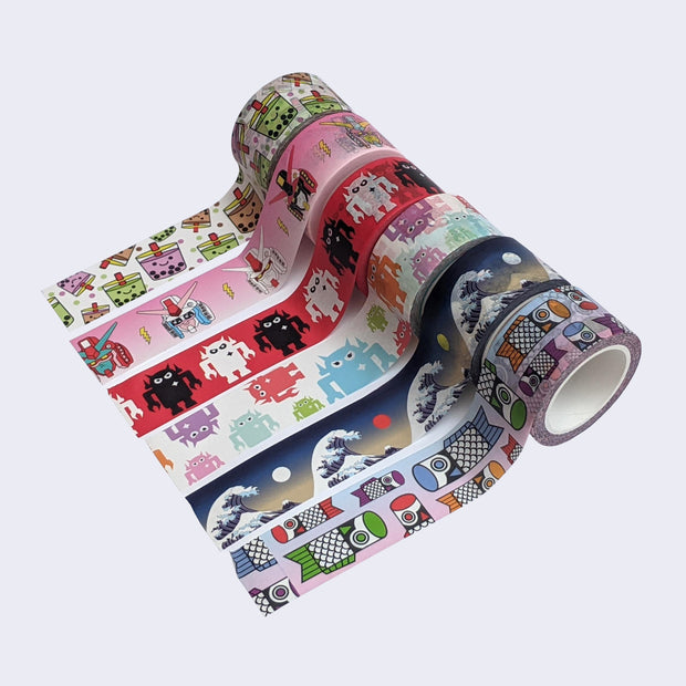  Group photo of 6 differently designed washi tapes. Designs include boba pattern, kawaii gundam, red, white and black Big Boss, pastel Big Boss, wave pattern, and koinobori pattern.