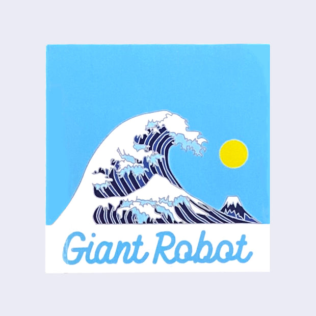 Blue square sticker with a blue striped wave design, with white foam atop the waves, akin to Hokusai print "The Great Wave off Kanagawa." A yellow sun is in the sky and a small mountain can be seen in the background. "Giant Robot" is written in blue cursive on white background below design.
