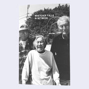 Zine cover with black and white photo of a smiling elderly woman standing in between two elderly men. "Whatever Falls In Between" is written in small, all caps font.