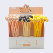 Pen display, white with peach color accents. Three clear cups hold a bundle of shiba inu topped pens.