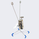 Small robotic toy with a rectangular body, 4 thin wire legs with blue boots on each. Most of the inner workings can be seen from the side and a silver crank is on the side.