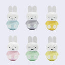 6 plastic Miffy figures, each with a different pastel color shirt, with rounded bottoms so that they wobble when on a surface. Shirt colors are pastel: blue, purple, orange, pink, green and yellow.