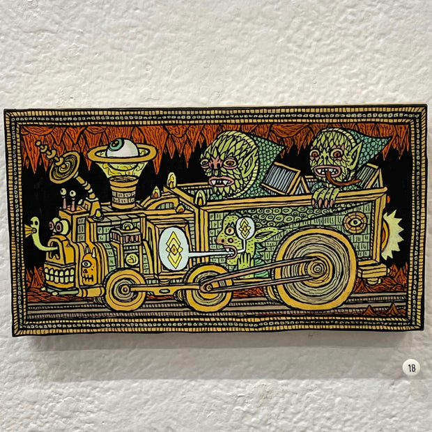 Illustration on wood with a yellow and black patterned border. 2 matching green monsters in pointy hats ride in a railroad cart that has a floating eyeball mechanism and a series of faces as the front of the car.