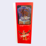 Side angle of display box, featuring photograph of figure's back and text that says "Tattoo on his back!" Bottom of box has photo of  figure with its arms extended out with text "Wide Range of Motion!" over it.